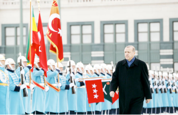 Turkish President Tayyip Erdogan reviews a guard of honour during a welcoming ceremony at the Presidential Palace in Ankara. — Reuters
