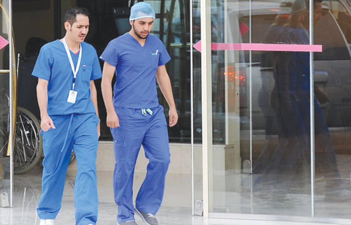 Saudi medical staff leave the emergency department at a hospital in the center of Riyadh. — Archives