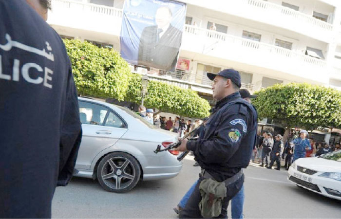 Algerian police officers take to the streets in an attempt to arrest activists in Algiers in this file photo. — AP