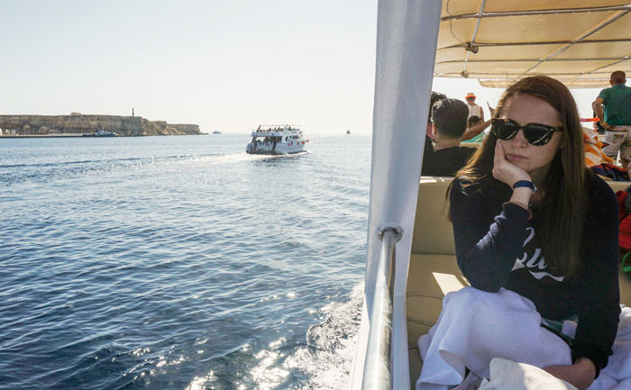 A tourist sitting in a boat off the Egyptian Red Sea resort of Sharm El-Sheikh. — AFP