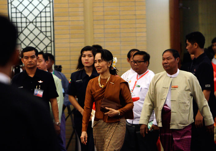 Myanmar State Counselor Aung San Suu Kyi, center, arrives to attend a ceremony to mark the 70th anniversary of Mon National Day, at the Myanmar International Convention Centre in Naypyitaw, Myanmar, on Sunday. — AP