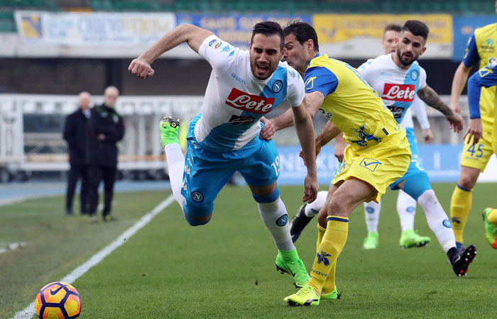 Napoli's Nikola Maksimovic, left, reaches for the ball during a Serie A soccer match between Chievo Verona and Napoli, at the Bentegodi stadium in Verona, Italy, Sunday. — AP