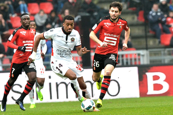 Nice's French forward Alassane Plea (C) vies with Rennes' French midfielder Sanjin Prcic (R) during the French L1 football match on Sunday at the Roazhon Park, in Rennes. — AFP