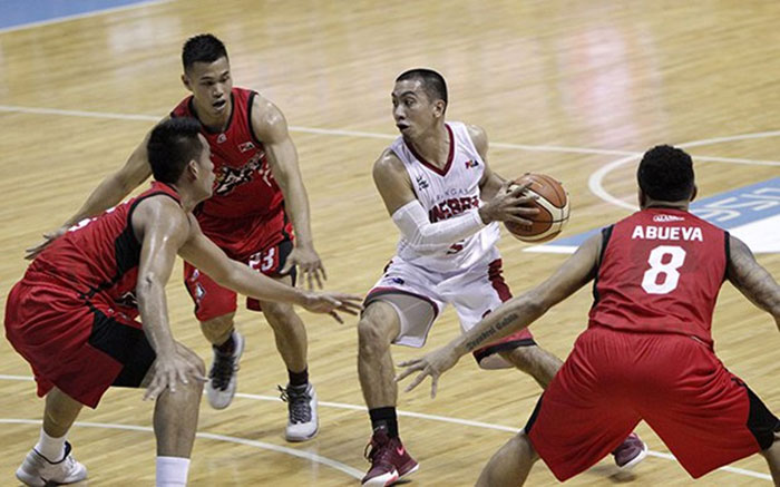 Ginebra's LA Tenorio gets triple teamed by Alaska's (counterclockwise) Abel Galliguez, Vic Manuel and Calvin Abueva in their PBA Philippine Cup quarterfinals knockout match at the Smart-Araneta Coliseum on Tuesday night. — SG photo