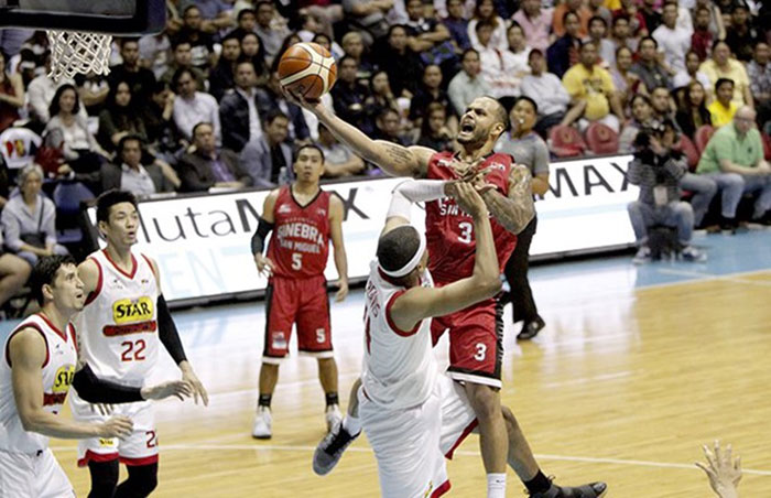 Ginebra's Sol Mercado barrels through the defense of Star's Rafi Reavis in Game 6 of their PBA Philippine Cup semifinal series at the Mall of Asia Arena Sunday night.