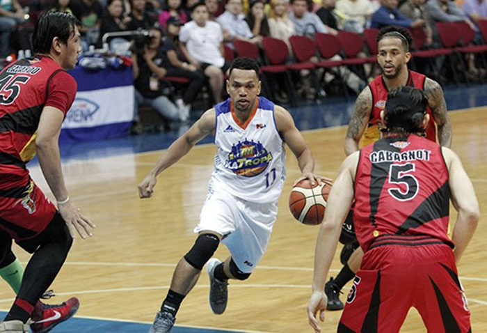 TNT's Jayson Castro drives to the basket as San Miguel Beer's June Mar Fajardo (L), Alex Cabagnot and Chris Ross surround him in Game 2 of their best-of-7 PBa Philippine Cup semifinal series at the Mall of Asia Arena Friday night.