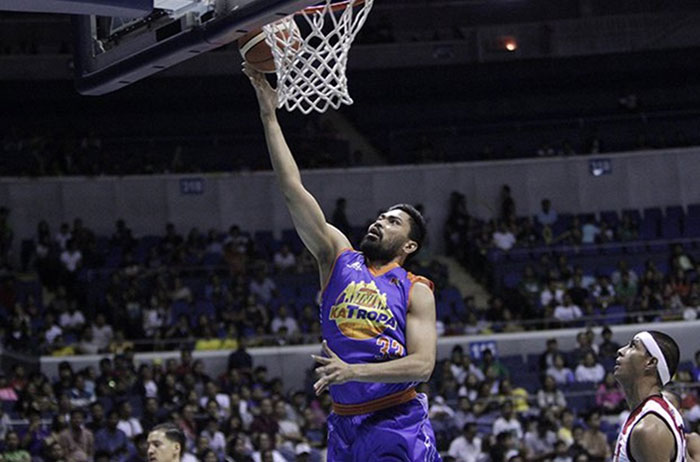 TNT's Ranidel de Ocampo catches San Miguel Beer defenders napping for an easy layup in Game 3 of their PBA Philippine Cup semifinal series at the Smart-Araneta Coliseum Sunday night.