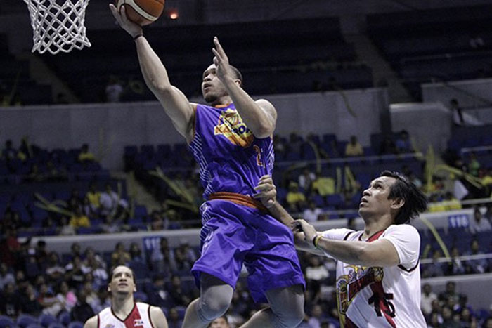 Star's Kelly Williams lays up after getting past San Miguel Beer's June Mar Fajardo (R) and Marcio Lassiter in Game 5 of their PBA Philippine Cup semifinal series at the Cuneta Astrodome Thursday night.