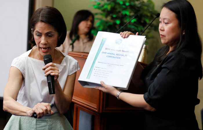Philippine Environment secretary Regina Lopez speaks during a press briefing as her aide holds an audit report of a mine she ordered closed in Manila, Philippines, in this Feb. 9, 2017 file photo. — Reuters