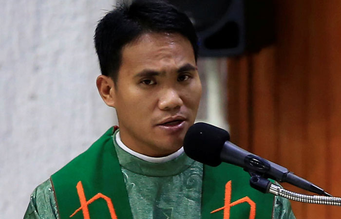 Rev. Fr. Andrean Francisco, a Catholic priest, reads the pastoral letter during a mass at a Sta. Rita de Cascia Parish in Paranaque city, Metro Manila, Philippines on Saturday.  — Reuters