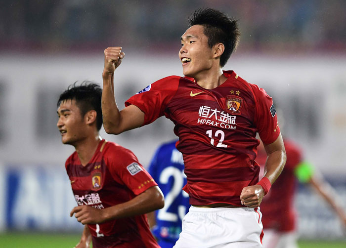 Wang Shangyuan (C) of Guangzhou Evergrande celebrates during their AFC Champions League group stage football match against Eastern FC in Guangzhou Wednesday. — AFP