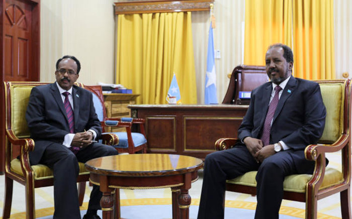 Somalia's newly elected President Mohamed Abdullahi Mohamed, left, poses for a photograph with the outgoing President Hassan Sheikh Mohamud, right, during the handover ceremony inside the Presidential palace in Mogadishu in this Feb. 16, 2017 file photo. — Reuters