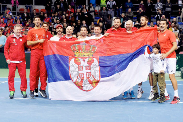 Serbia’s players celebrate their victory against Russia during the first round Davis Cup World Group match at Cair Sports Hall in Nis Saturday. — AFP