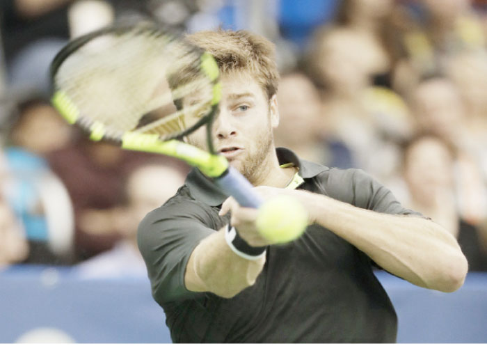 Ryan Harrison of the US returns a shot to countryman Donald Young at the Memphis Open Tennis Tournament in Memphis Saturday. — AP