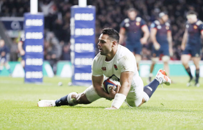 England’s Ben Te’o celebrates scoring their first try against France in the Six Nations Rugby Championship in Twickenham Saturday. — Reuters