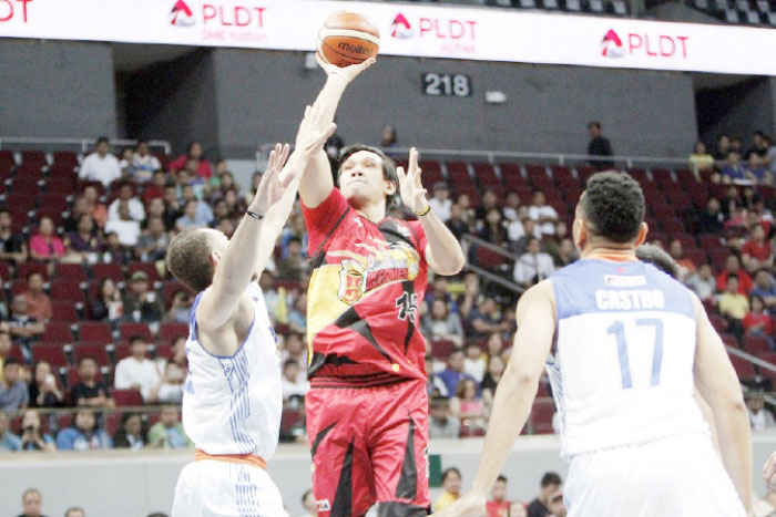 San Miguel Beer’s June Mar Fajardo fires a shot off TNT’s Kelly Williams (L) as Jayson Castro (R) reacts in Game 6 of their best-of-7 semifinal series at the Mall of Asia Arena Saturday night.