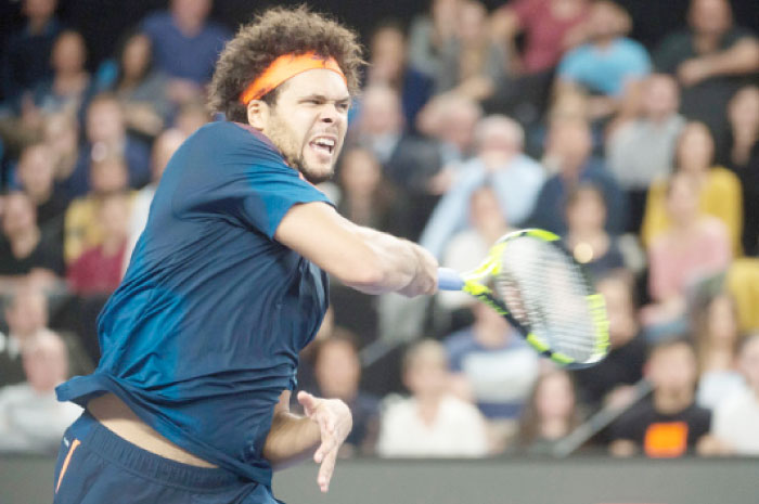 France’s Jo-Wilfried Tsonga returns the ball to Australia’s Nick Kyrgios during their ATP Marseille Open 13 semifinal tennis match in Marseille Saturday. — AFP