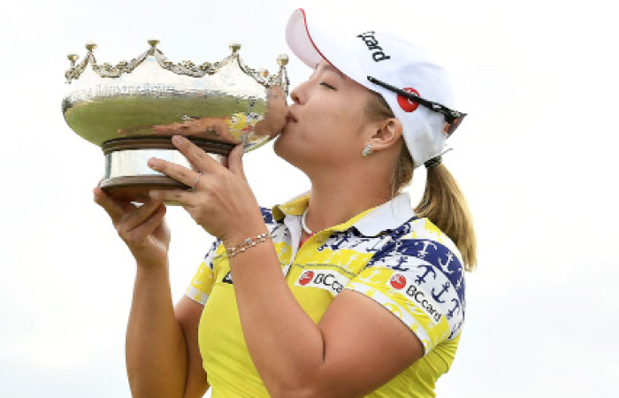 Jang Ha-na with the Australian Open trophy. — AFP