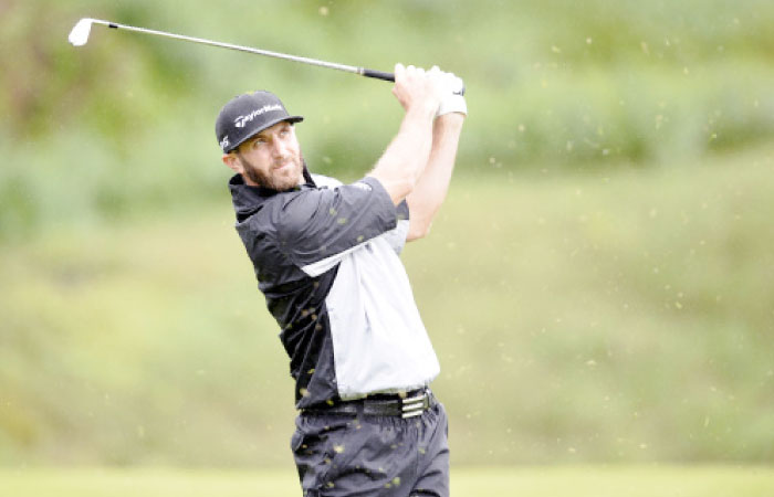 Dustin Johnson hits from the sixth hole tee box during the continuation of second round play in the Genesis Open Golf Tournament at Riviera Country Club in Pacific Palisades Saturday. — Reuters