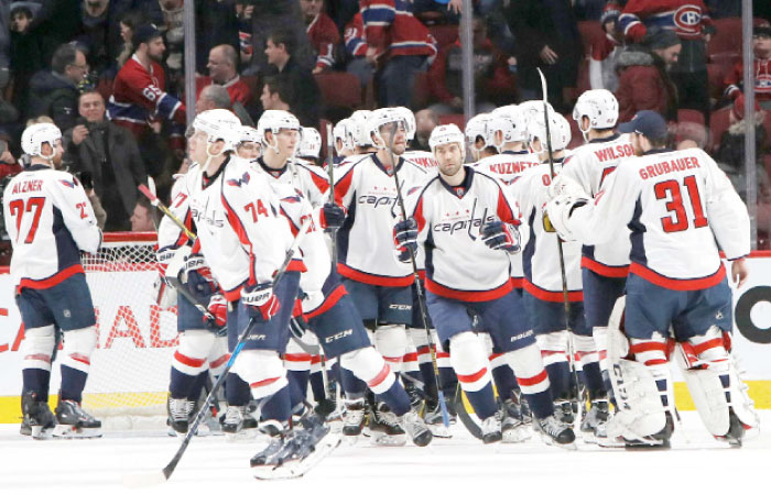 Washington Capitals’ players celebrate their win against Montreal Canadiens at Bell Centre in Montreal Saturday. — Reuters