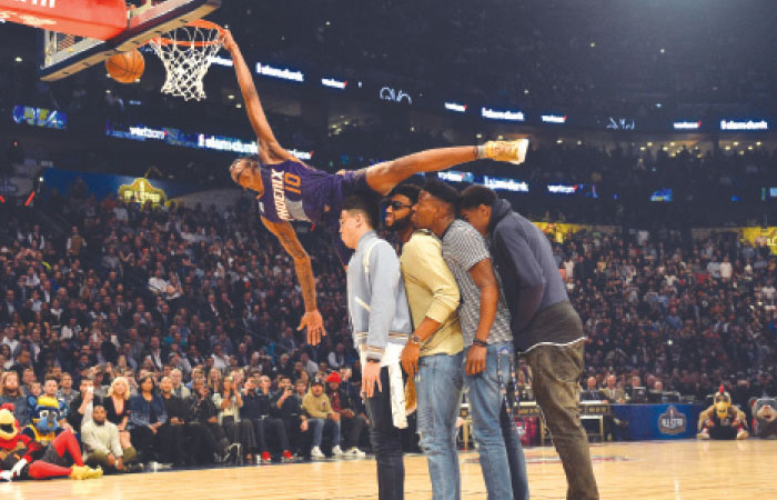 Phoenix Suns’ forward Derrick Jones Jr. attempts a dunk over his teammates in the slam dunk contest during NBA All-Star Saturday Night events in New Orleans. — Reuters