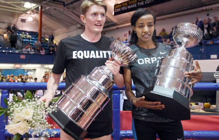 Wanamaker Mile winners Eric Jenkins (US) and Sifan Hassan (NED) pose with trophies during the 110th Millrose Games at The Armory in New York Saturday. — Reuters