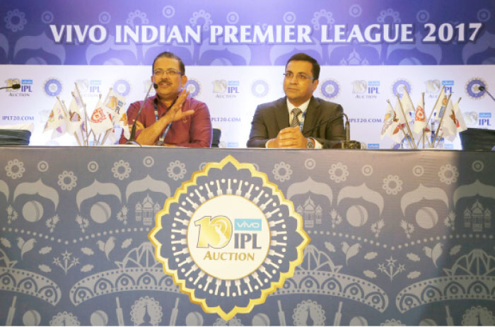 Board of Control for Cricket in India Chief Executive Officer Rahul Johri, right, listens to Kolkata Knight Riders team Chief Executive Officer Venky Mysore at a press conference during the Indian Premier League (IPL) player auction in Bangalore, India, Monday. — AP