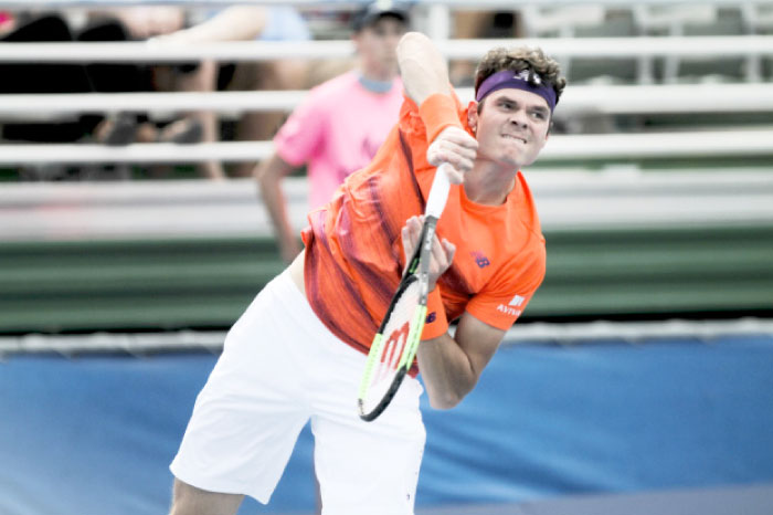 Milos Raonic serves to Tim Smyczek during the Delray Beach Open in Miami Tuesday. — AP