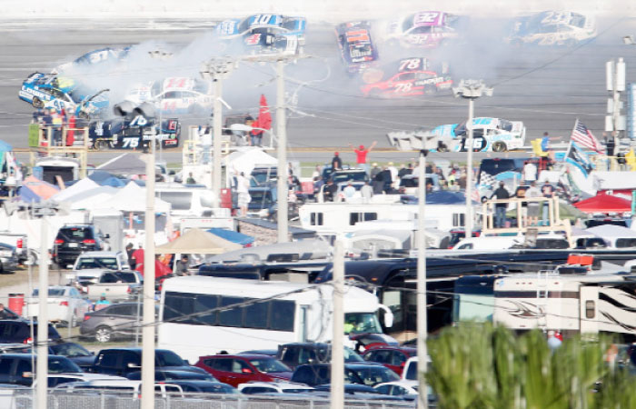 Drivers including Jimmie Johnson, driver of the No. 48 Lowe’s Chevrolet, Kevin Harvick, driver of the No. 4 Jimmy John’s Ford, Danica Patrick, driver of the No. 10 Aspen Dental Ford, and Clint Bowyer, driver of the No. 14 Mobil 1 Ford, are involved in an on-track incident during the 59th Annual Daytona 500 at Daytona International Speedway on Sunday. — AFP