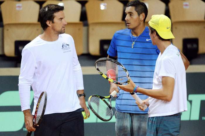 The above Jan. 29, 2014, file photo shows Australia’s Davis Cup captain Pat Rafter (L) talking with players Thanasi Kokkinakis (R) and Nick Kyrgios (C) during a training session before the Davis Cup match against France at The Vendespace in Mouilleron-le-Captif, western France. — AFP