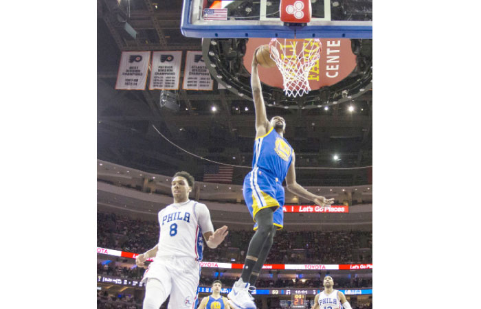 Golden State Warriors’ Kevin Durant, right, goes up for the shot as he gets past Philadelphia 76ers’ Jahlil Okafor, left, during the second half of an NBA basketball game, Monday in Philadelphia. — AP