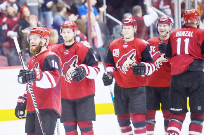 Arizona Coyotes center Max Domi (16) celebrates with teammates after beating the Anaheim Ducks 3-2 at Gila River Arena. — Reuters