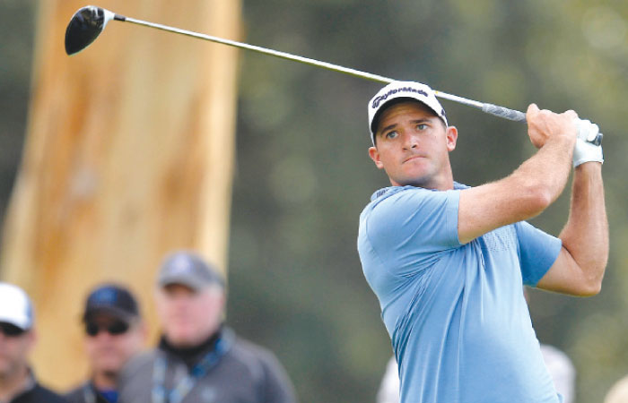 Sam Saunders hits from the ninth hole tee box during the first round of the Genesis Open Golf Tournament at Riviera Country Club in Pacific Palisades Thursday. — Reuters