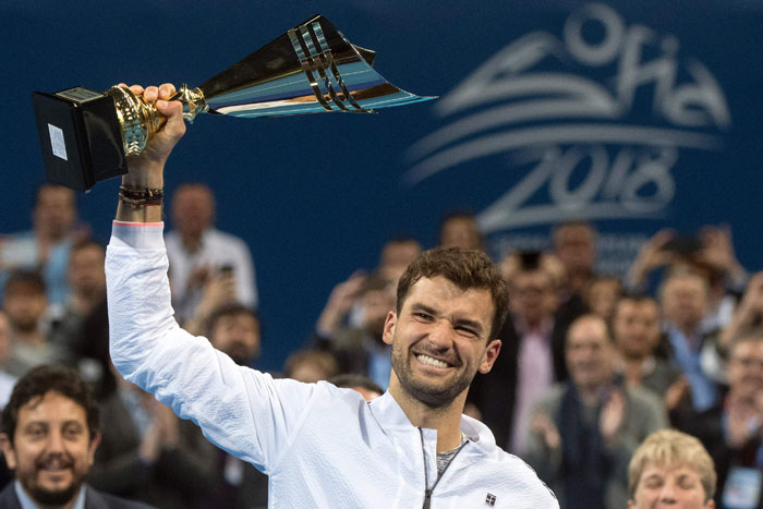 Bulgaria's Grigor Dimitrov poses with his trophy after winning the final against Belgium's David Goffin during the ATP Garanti Koza Sofia Open Tennis Tournament in Sofia Sunday. — AFP