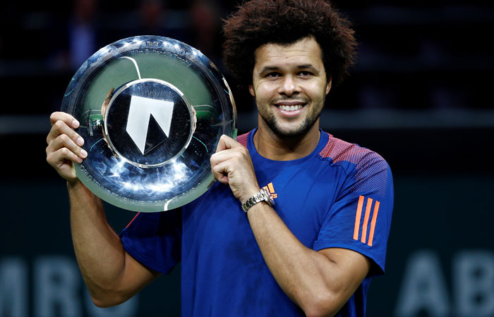 Jo-Wilfried Tsonga of France celebrates with the trophy after winning the final against David Goffin of Belgium at the Rotterdam World Tennis Tournament Sunday. — Reuters