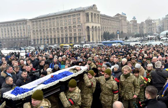 Servicemen carry the coffin with the body of one of the seven Ukrainian soldiers who died during fighting in the eastern Ukrainian town of Avdiivka, during a mourning ceremony on Independence Square in Kiev, on Wednesday. — AFP