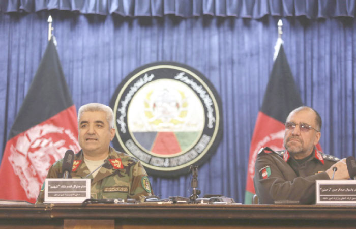 Afghan Army Chief of Staff General Qadam Shah Shahim, left, and Deputy Interior Minister General Abdul Rahman Rahman, give a news conference, in Kabul, Afghanistan, on Saturday. — AP