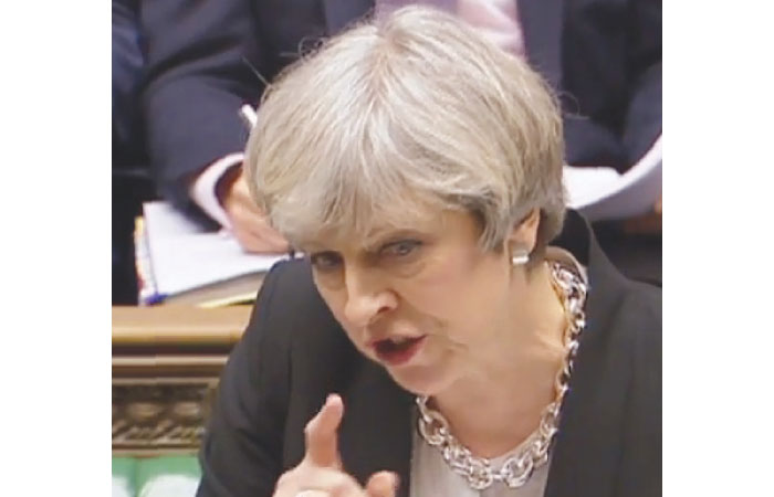 British Prime Minister Theresa May speaks during the weekly Prime Minister’s Questions session in the House of Commons in central London. — AFP