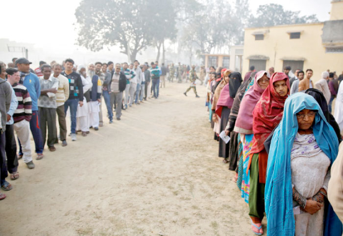 People queue to vote during the state assembly election, in the town of Deoband, in the state of Uttar Pradesh, India, on Wednesdsay. — Reuters