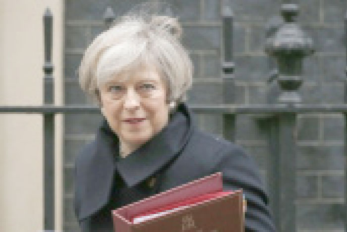 Britain’s Prime Minister Theresa May leaves 10 Downing Street for the House of Commons for her weekly Prime Ministers Questions in London, Wednesday. — AP