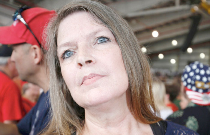 Tammy Allen of Melbourne, Florida, an ardent supporter of US President Donald Trump, attends a rally at the Orlando Melbourne International Airport in Melbourne, Florida, on Saturday. — AFP