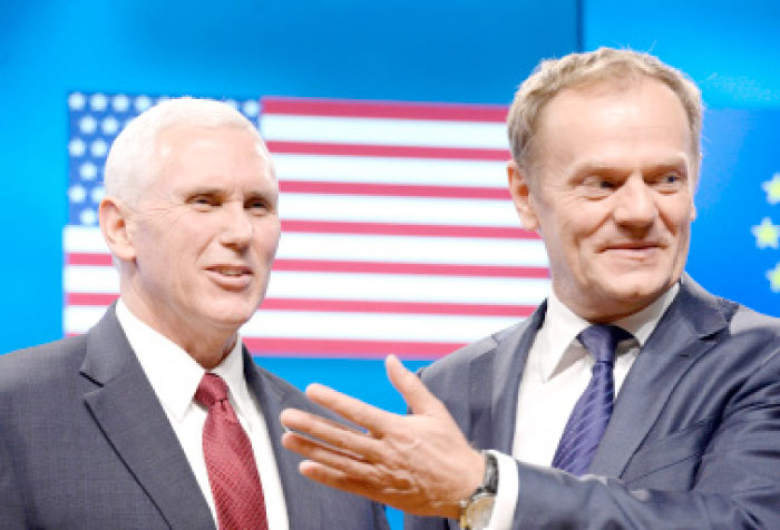 US Vice-President Mike Pence, left, and European Council head Donald Tusk speak after their meeting at the European Commission in Brussels on Monday. — AFP