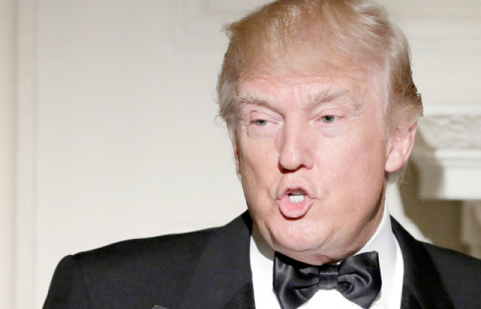 US President Donald Trump speaks during the Governor’s Dinner in the State Dining Room at the White House in Washington D.C. on Sunday. — Reuters