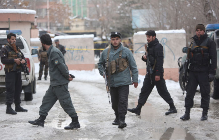 Police officers inspect the site of suicide attack at the Supreme Court in Kabul, Afghanistan, Tuesday. — AP