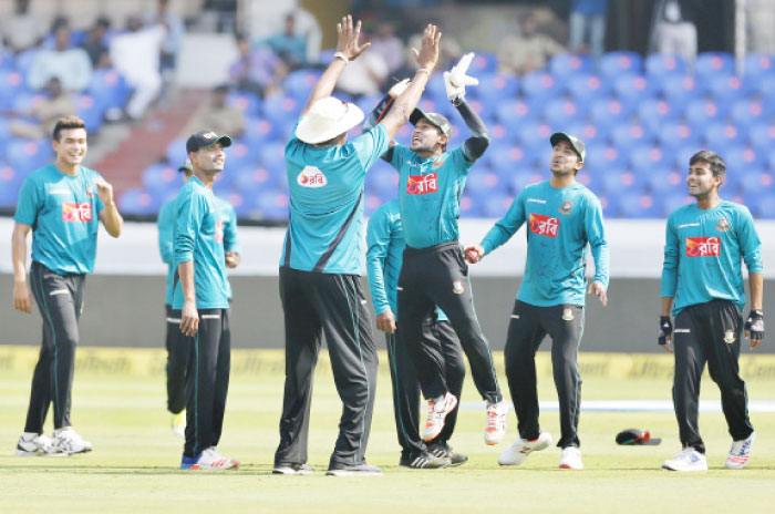 Bangladesh cricket team captain Mushfiqur Rahim (3rd R) jumps to give high-five to bowling coach Courtney Walsh during a training session ahead of their Test match against India at Rajiv Gandhi International Cricket Stadium in Hyderabad  Wednesday. — AP