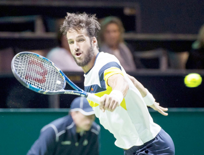 Spain’s Feliciano Lopez returns a ball during his match against French tennis player Pierre-Hughes Herbert on Monday in Rotterdam, during the ABN AMRO World Tennis Tournament. Netherlands. — AFP