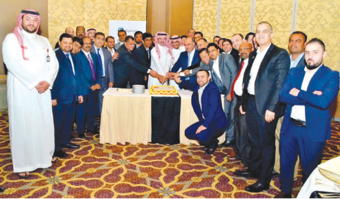 Prince Waleed Nasser F. Al-Saud, Vice President, Business Support, RICC, with other executives of RICC and Cognizant during the cutting of the ceremonial cake following the agreement