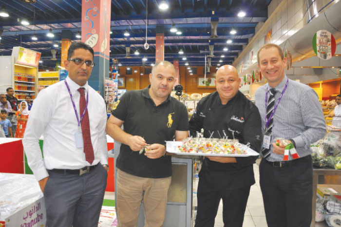 Chef Massimo Sgobba and Andrew Holmes, operation director for Danube, with other officials during the festival