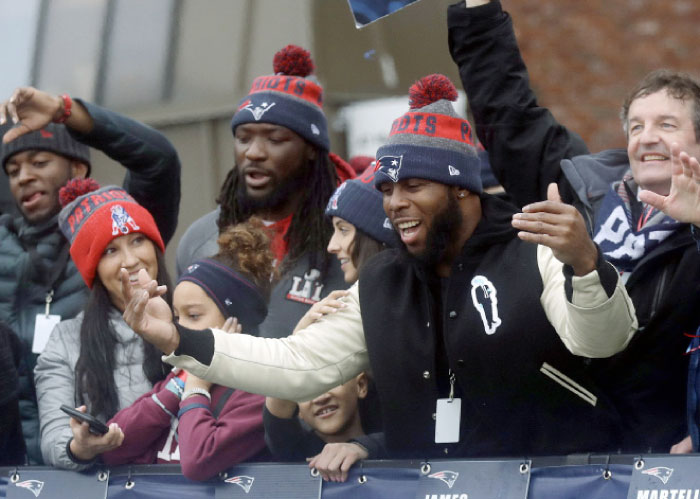 New England Patriots running backs James White, front, and LeGarrette Blount, center rear, ride in a parade Tuesday, Feb. 7, in Boston to celebrate the team’s 34-28 win over the Atlanta Falcons in Sunday’s NFL Super Bowl 51 football game in Houston. — AP