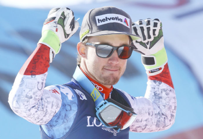 Gold medalist Luca Aerni of Switzerland celebrates during the flower ceremony after winning the FIS Alpine Skiing World Championships - Men’s Alpine Combined - Slalom at St. Moritz.  — Reuters